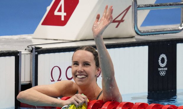 CORRECTS NAME AND RACE - Emma Mckeon, of Australia, celebrates after winning the gold medal in the ...