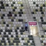 
              A security officer looks out over an empty stadium before the opening ceremony in the Olympic Stadium at the 2020 Summer Olympics, Friday, July 23, 2021, in Tokyo, Japan. (AP Photo/David J. Phillip)
            