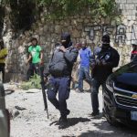 
              Security forces investigate the perimeters of the residence of Haitian President Jovenel Moise, in Port-au-Prince, Haiti, Wednesday, July 7, 2021. Gunmen assassinated Moise and wounded his wife in their home early Wednesday. (AP Photo/Joseph Odelyn)
            