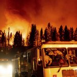
              Firefighters arrive at Frenchman Lake to battle the Sugar Fire, part of the Beckwourth Complex Fire, burning in Plumas National Forest, Calif., on Thursday, July 8, 2021. (AP Photo/Noah Berger)
            