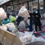 
              Volunteers participate in the cleaning efforts at Soweto's Diepkloof mall outside Johannesburg, South Africa, Thursday July 15, 2021. A massive cleaning effort has started following days of violence in Gauteng and KwaZulu-Natal provinces. The violence erupted last week after Zuma began serving a 15-month sentence for contempt of court for refusing to comply with a court order to testify at a state-backed inquiry investigating allegations of corruption while he was president from 2009 to 2018. (AP Photo/Jerome Delay)
            