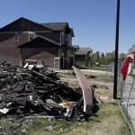 
              FILE - In this May 4, 2017, file photo, workers dismantle the charred remains of a home at the location where an explosion killed two people in Firestone, Colo. Fire officials said an investigation revealed that the April 17, 2017, explosion was caused by natural gas that was leaking from a small, abandoned flowline from a nearby well. (AP Photo/Brennan Linsley, File)
            