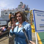 
              Speaker of the House Nancy Pelosi talks to the media in front of USNS John Lewis after a christening ceremony Saturday July 17, 2021, in San Diego. (AP Photo/Denis Poroy)
            