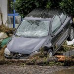 
              A damaged car is seen in Insul at the Ahr river, western Germany, Thursday, July 15, 2021. Due to heavy rain falls the Ahr river dramatically went over the banks the evening before. People have died and dozens of people are missing in Germany after heavy flooding turned streams and streets into raging torrents, sweeping away cars and causing some buildings to collapse. (AP Photo/Michael Probst)
            
