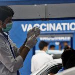 
              A health worker prepare the Sinovac COVID-19 vaccine at a drive-through vaccination center, in Karachi, Pakistan, Saturday, July 31, 2021. (AP Photo/Fareed Khan)
            