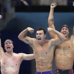 
              United States men's 4x100m freestyle relay team of Bowen Beck, Blake Pieroni, and Caeleb Dressel react after winning the gold medal at the 2020 Summer Olympics, Monday, July 26, 2021, in Tokyo, Japan. (AP Photo/Matthias Schrader)
            