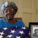 
              CORRECTS NAME OF BATTALION - World War II veteran Maj. Fannie Griffin McClendon poses at her home, Thursday, June 10, 2021, in Tempe, Ariz. McClendon had a storied history as a member of the 6888th Central Postal Directory Battalion that made history as being the only all-female, black unit to serve in Europe during World War II. (AP Photo/Matt York)
            