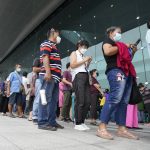 
              Residents wait on line to receive shots of the AstraZeneca COVID-19 vaccine at the Central Vaccination Center in Bangkok, Thailand, Thursday, July 22, 2021. (AP Photo/Sakchai Lalit)
            