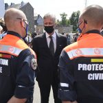 
              Belgium's King Philippe, center, speaks with members of the Civil Protection Unit prior to participating in a ceremony of one minute of silence to pay respect to victims of the recent floods in Belgium, in Verviers, Belgium, Tuesday, July 20, 2021. Belgium is holding a day of mourning on Tuesday to show respect to the victims of the devastating flooding last week, when massive rains turned streets in eastern Europe into deadly torrents of water, mud and flotsam. (Eric Lalmand, Pool Photo via AP)
            