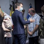 
              Belgium's Prime Minister Alexander De Croo, center, speaks with residents affected by the recent flooding in Verviers, Belgium, Tuesday, July 20, 2021. Belgium is holding a day of mourning on Tuesday to show respect to the victims of the devastating flooding last week, when massive rains turned streets in eastern Europe into deadly torrents of water, mud and flotsam. (AP Photo/Valentin Bianchi)
            