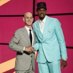 
              Evan Mobley, right, poses for a photo with NBA Commissioner Adam Silver after being selected third overall by the Cleveland Cavaliers during the NBA basketball draft, Thursday, July 29, 2021, in New York. (AP Photo/Corey Sipkin)
            
