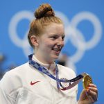 
              Lydia Jacoby, of the United States, poses with the gold medal after winning the final of the women's 100-meter breaststrokeat the 2020 Summer Olympics, Tuesday, July 27, 2021, in Tokyo, Japan. (AP Photo/Petr David Josek)
            