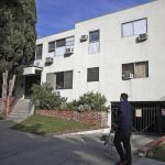 
              FILE - This Jan. 8, 2019, file photo, shows the building housing the apartment of Ed Buck in West Hollywood, Calif., following the death of a man the previous day. Nearly two years after the wealthy Democratic donor was finally arrested and charged by federal prosecutors, Buck is going on trial Tuesday, July 13, 2021, on charges with providing fatal doses to two men, running a drug den and enticing men to travel for prostitution. (AP Photo/Jae C. Hong, File)
            