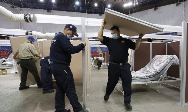 FILE — In this April 18, 2020, file photo, partitions are installed between beds as Sleep Train A...