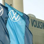 
              FILE - In this file photo dated Thursday, April 23, 2020, company logo flags wave in front of a Volkswagen factory building in Zwickau, Germany.Luxury brands Audi and Porsche are fattening the bottom line at German automaker Volkswagen. The company's premium brands saw record sales in the first half of the year. That helped the Wolfsburg-based auto giant make more money than it did even before the pandemic. (AP Photo/Jens Meyer, File)
            