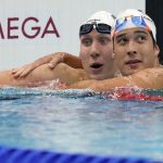 
              Chase Kalisz, left, of the United States, celebrates with teammate Jay Litherland after winning the final of the men's 400-meter individual medley at the 2020 Summer Olympics, Sunday, July 25, 2021, in Tokyo, Japan.
            