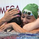 
              Gold medalist Lydia Jacoby of the United States, left, is embraced by silver medalist Tatjana Schoenmaker of South Africa after winning the final of the women's 100-meter breaststroke at the 2020 Summer Olympics, Tuesday, July 27, 2021, in Tokyo, Japan. (AP Photo/Matthias Schrader)
            
