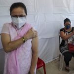 
              Women hold their arms after receiving Covishield vaccine against the coronavirus at a vaccination center in Mumbai, India, Sunday, July 4, 2021. (AP Photo/Rafiq Maqbool)
            