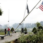 
              Jefferson County residents inspect damage at Dahnert Park, Thursday, July 29, 2021 in Concord, Wis., following an overnight storm. (John Hart/Wisconsin State Journal via AP)
            