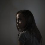 
              Suzy Ishkontana, 7, poses for a portrait in the house of a family member where she is currently living after her house was destroyed in an airstrike during an 11-day war in Gaza City, Wednesday, June 16, 2021. Suzy's mother, her two brothers and two sisters -- ages 9 to 2 -- died in the May 16 Israeli attack on the densely packed al-Wahda Street in Gaza City. Israeli authorities say the bombs' target was Hamas tunnels; 42 people died, including 16 women and 10 children. “My kids who died and my wife, they are now in a safe place and there is no worry about them, but my greater fear is for Suzy,” says her father, Riad Ishkontana. (AP Photo/Felipe Dana)
            