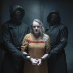 
              This image released by Hulu shows Elisabeth Moss in a scene from "The Handmaid's Tale." The program was nominated for an Emmy Award for outstanding drama series. (Hulu via AP)
            