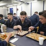 
              Sailors of the  guided-missile destroyer USS Ross, eat and play chess as they rest during Sea Breeze 2021  maneuvers,  in the Black Sea, Thursday, July 8, 2021. Ukraine and NATO have conducted Black Sea drills involving dozens of warships in a show of strong defense ties amid the heightened tensions in the wake of last month's incident with a British destroyer off Crimea. (AP Photo/Efrem Lukatsky)
            
