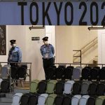 
              Security personnel wait for the start of the opening ceremony in an empty Olympic Stadium at the 2020 Summer Olympics, Friday, July 23, 2021, in Tokyo, Japan. (AP Photo/Patrick Semansky)
            