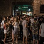 
              People talk and drink in downtown Barcelona, Spain, late Saturday, July 3, 2021. (AP Photo/Joan Mateu)
            