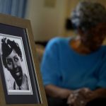 
              CORRECTS NAME OF BATTALION - World War II veteran Maj. Fannie Griffin McClendon shows an image of herself during her time in the military, at her home Thursday, June 10, 2021, in Tempe, Ariz. McClendon had a storied history as a member of the 6888th Central Postal Directory Battalion that made history as being the only all-female, black unit to serve in Europe during World War II. (AP Photo/Matt York)
            