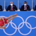 
              Sun Wei, of China, performs on the floor exercise during the artistic gymnastic men's team final at the 2020 Summer Olympics, Monday, July 26, 2021, in Tokyo. (AP Photo/Ashley Landis)
            