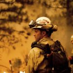 
              Firefighter Jesse Forbes monitors flames as his crew burns vegetation to stop the Dixie Fire from spreading near Prattville in Plumas County, Calif., on Friday, July 23, 2021. (AP Photo/Noah Berger)
            
