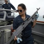 
              CAPTION CORRECTS DATE US Navy sailor of the destroyer USS Ross, Christina Cortez from Sant Diego, California, prepares a machine gun, during Sea Breeze 2021 maneuvers, in the Black Sea, Wednesday, July 7, 2021.  Ukraine and NATO have conducted Black Sea drills involving dozens of warships in a two-week show of their strong defense ties and capability following a confrontation between Russia's military forces and a British destroyer off Crimea last month.  (AP Photo/Efrem Lukatsky)
            