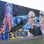 
              A mural by Fernandezgraphics of Blue Origin and Amazon founder Jeff Bezos is seen on the wall of a building Tuesday in Van Horn, Texas.  Bezos has blasted into space on his rocket company’s first flight with passengers. He’s the second billionaire in just over a week to ride his own spacecraft. The Amazon founder rode to space with a hand-picked group and their Blue Origin capsule landed 10 minutes later on the desert floor in West Texas.  (Jacob Ford/Odessa American via AP)
            
