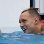 
              Caeleb Dressel, of United States, celebrates wining a men's 50-meter freestyle heat at the 2020 Summer Olympics, Friday, July 30, 2021, in Tokyo, Japan. (AP Photo/Gregory Bull)
            