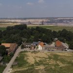 
              The village of Luetzerath, Germany, is set to be evicted for the build of a coal mine, Tuesday, July 20, 2021. The village stands just a few hundred meters from a vast pit where German utility giant RWE is extracting lignite coal to burn in nearby power plants. (AP Photo/Bram Janssen)
            