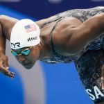 
              Simone Manuel, of United States, swims in a women's 50-meter freestyle heat at the 2020 Summer Olympics, Friday, July 30, 2021, in Tokyo, Japan. (AP Photo/Gregory Bull)
            
