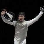 
              Ka Long Cheung of Hong Kong celebrates defeating Daniele Garozzo of Italy in the men's individual final Foil competition at the 2020 Summer Olympics, Monday, July 26, 2021, in Chiba, Japan. (AP Photo/Hassan Ammar)
            