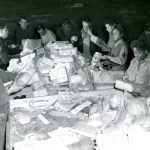 
              In this photo provided by the U.S. Army Women’s Museum, members of the 6888th battalion sort mail with French civilians in Rouen, France, in 1945. The Women's Army Corps battalion, which made history as the only all-female Black unit to serve in Europe during World War II, is set to be honored by Congress. (U.S. Army Women's Museum via AP)
            