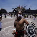 
              Mexican dancers perform during a ceremony as part of the commemoration marking the 700 year anniversary of the founding of the Aztec city of Tenochtitlan, known today as Mexico City, in Mexico City, Monday, July 26, 2021, amid the new coronavirus pandemic. (AP Photo/Fernando Llano)
            