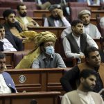 
              Parliament members listen to a speech by President Ashraf Ghani during the extraordinary meeting of the Parliament in Kabul, Afghanistan, Monday, Aug. 2, 2021. (AP Photo/Rahmat Gul)
            