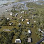 
              Homes are flooded in the aftermath of Hurricane Ida, Monday, Aug. 30, 2021, in Lafitte, La. The weather died down shortly before dawn. (AP Photo/David J. Phillip)
            