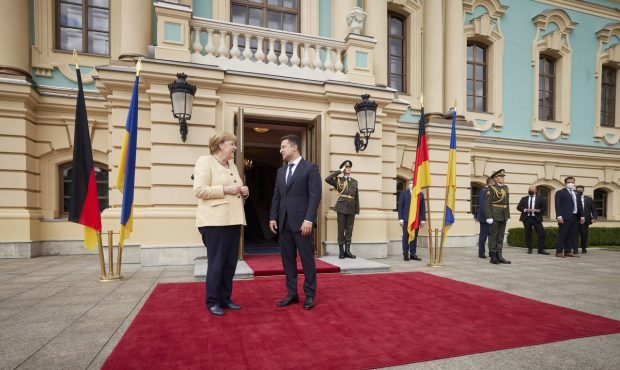 Ukrainian President Volodymyr Zelenskyy, right, greets German Chancellor Angela Merkel during their...