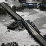 
              A barge damages a bridge that divides Lafitte, La., and Jean Lafitte, in the aftermath of Hurricane Ida, Monday, Aug. 30, 2021, in La. (AP Photo/David J. Phillip)
            