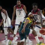 
              United States's Jrue Holiday (12), right, knocks the ball away from Australia's Patty Mills (5), front, during men's basketball semifinal game at the 2020 Summer Olympics, Thursday, Aug. 5, 2021, in Saitama, Japan. (AP Photo/Eric Gay)
            