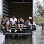 
              People are evacuated from floodwaters in the aftermath of Hurricane Ida in LaPlace, La., Monday, Aug. 30, 2021. (AP Photo/Gerald Herbert)
            