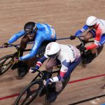 
              Kevin Santiago Quintero Chavarro of Team Colombia, left, and Jason Kenny of Team Britain compete during the track cycling men's keirin race at the 2020 Summer Olympics, Sunday, Aug. 8, 2021, in Izu, Japan. (AP Photo/Christophe Ena)
            