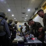 
              Marines of the 24th Marine Expeditionary Unit (MEU) process Department of State personnel for evacuation at Hamid Karzai International Airport, in Kabul, Afghanistan, Sunday, Aug. 15, 2021. (Sgt. Isaiah Campbell/U.S. Marine Corps via AP)
            