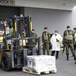 
              Kenyan soldiers guard a consignment of vaccines at Kenya Jomo Kenyatta airport in Nairobi on Friday, Aug.6. 2021. Kenya has received an additional 182,000 AstraZeneca vaccines from the Greek Government via the COVAX facility. It is a shot in the arm for Kenya as the country struggles to contain the surge in infection. (AP Photo/Brian Inganga)
            