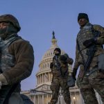 
              FILE - In this Jan. 19, 2021, file photo National Guard troops reinforce the security zone on Capitol Hill in Washington. Over the past year, National Guard members have been called in to battle the COVID-19 pandemic, natural disasters and race riots. (AP Photo/J. Scott Applewhite, File)
            