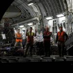 
              British military personnel prepare to remove cargo from a C-17 aircraft at RAF Brize Norton, Oxfordshire, late Sunday, Aug. 29, 2021. The final UK troops and diplomatic staff were airlifted from Kabul on Saturday, drawing to a close Britain's 20-year engagement in Afghanistan and a two-week operation to rescue UK nationals and Afghan allies. (Peter Nicholls/Pool Photo via AP)
            